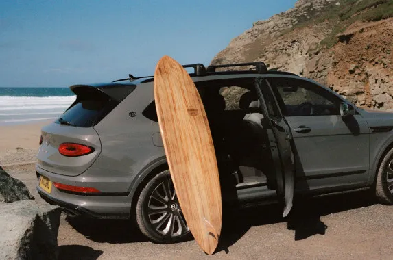Bentley Unveils Bespoke Koa Surfboard with Marnie Rays & Otter Surfboards